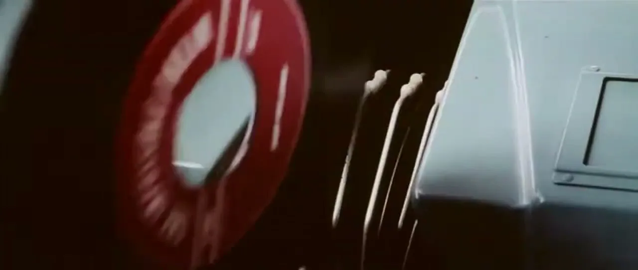 A red "REMOVE BEFORE FLIGHT" tag is pulled from a jet engine, revealing the engine's inner workings in a close-up shot.