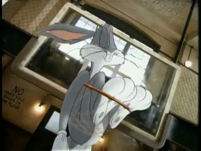 Bugs Bunny, a grey and white rabbit, falls through a basketball hoop in a gym, screaming in surprise.