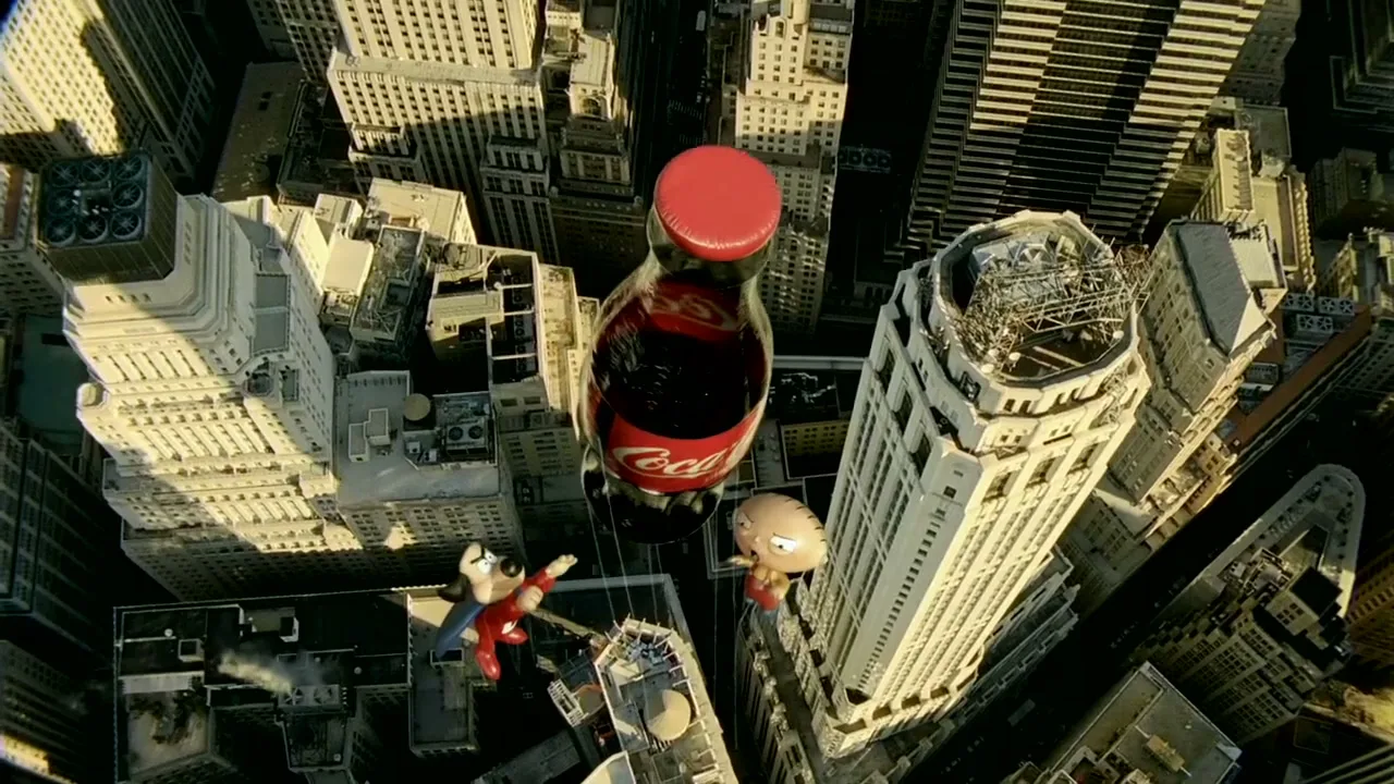 Stewie Griffin and Underdog, animated characters, float next to a giant Coca-Cola bottle high above a city with tall buildings.