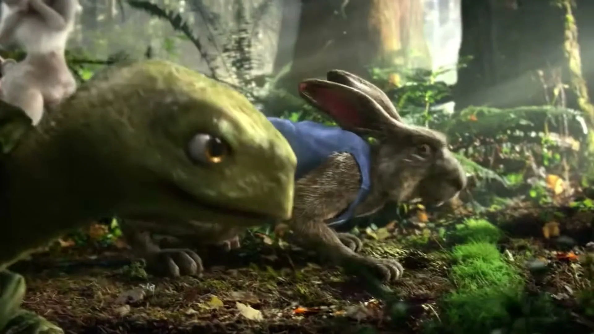 A CGI rabbit in a blue vest and a turtle are at the starting line of a race in a lush forest.