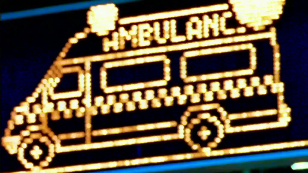 A pixelated ambulance icon, made of yellow lights, is displayed on a dark blue screen, with the word "AMBULANCE" visible above it.