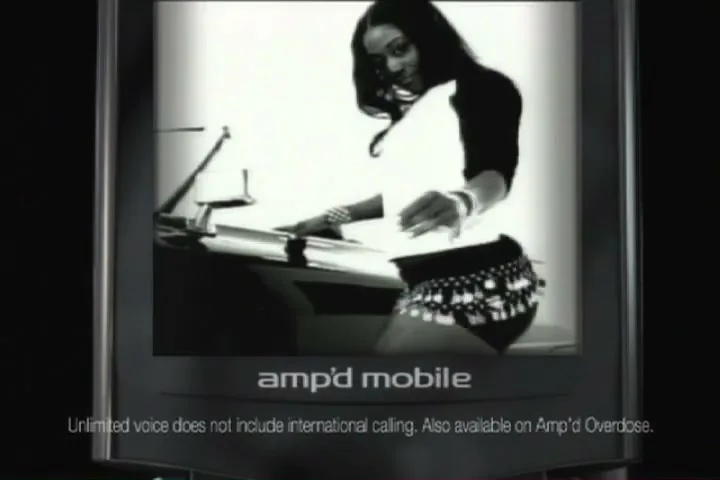 A woman with long dark hair, wearing a white shirt and a skirt with metallic embellishments, is seen from the waist up, dancing and mixing music on a DJ deck, displayed on a phone screen.