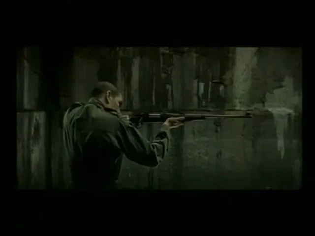 A man in a military uniform holds a rifle, aiming it at a wall in a dark, gritty room.