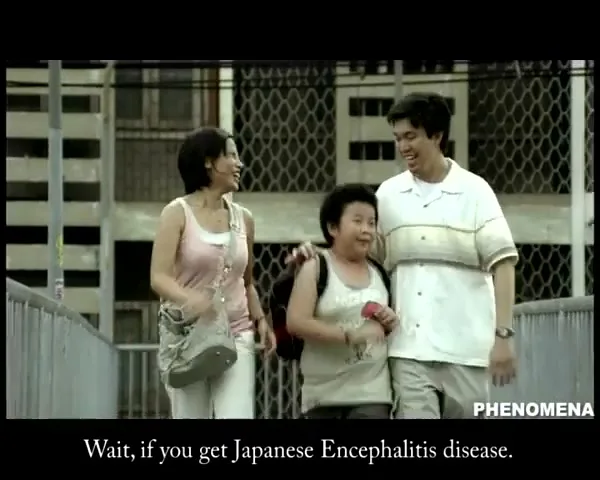 A family of three, a mother, father, and son, walk across a pedestrian bridge in a city, looking shocked and surprised.
