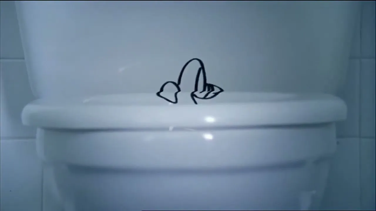 A penis doodle is drawn on a white toilet in a bathroom, then it wiggles and shrinks.