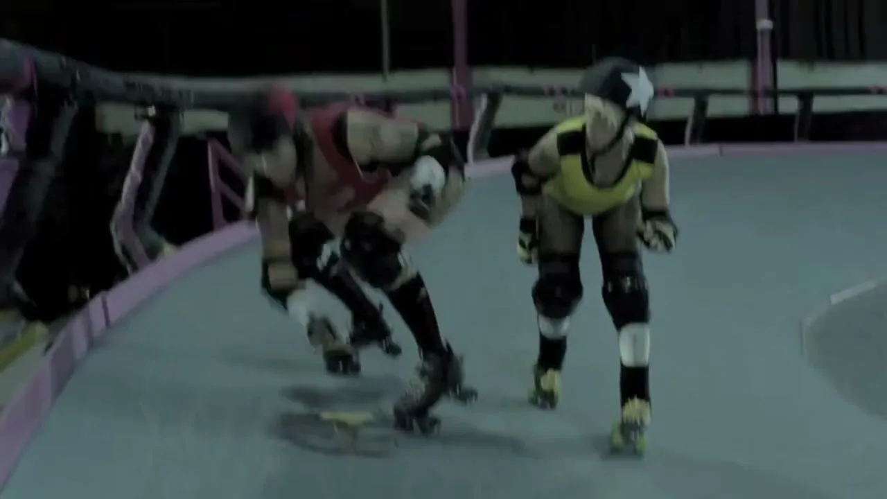 Two female roller derby players in protective gear and colorful uniforms skate aggressively on a track, with one player attempting to block the other.