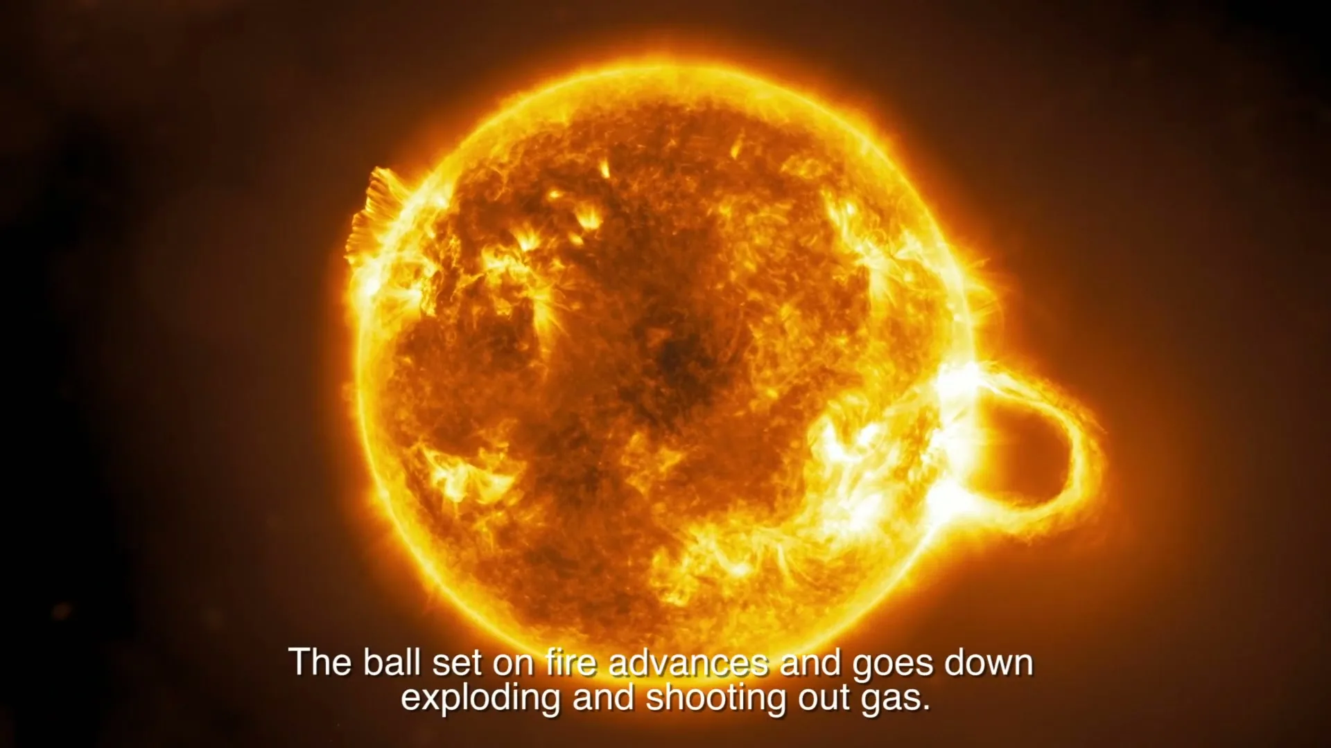 A bright, fiery sun with solar flares is shown in a wide shot, with Spanish subtitles translated to English at the bottom of the screen.