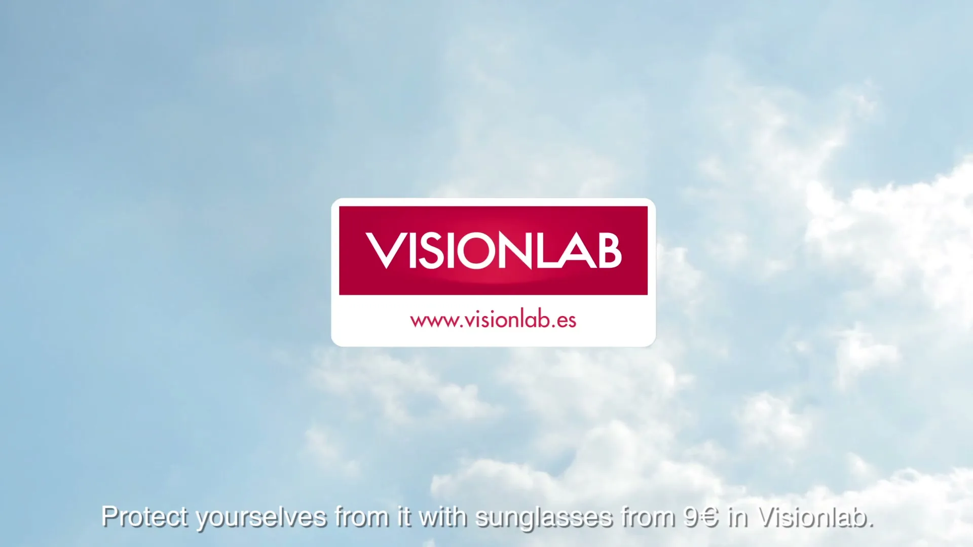 The Visionlab logo and website are displayed against a bright blue sky with soft white clouds, with a tagline at the bottom.