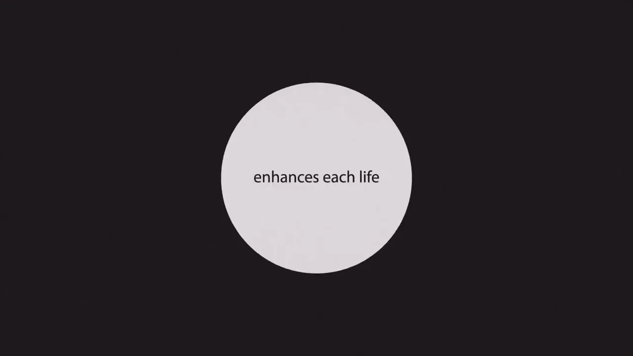 A white circle with the words "enhances each life" appears on a black background, then shrinks and expands to reveal "it touches."