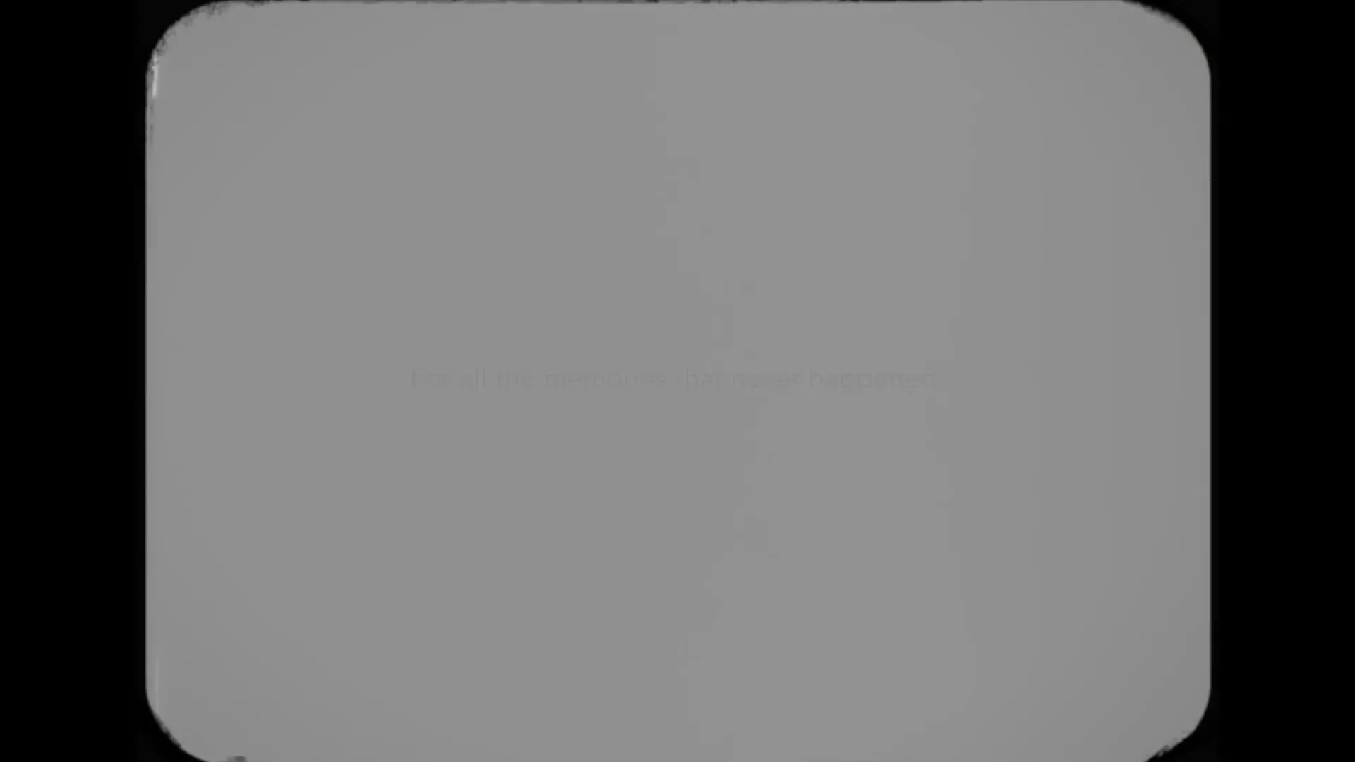 A vintage film frame with rounded corners shows the text "For all the memories that never happened." appearing on a light gray background.