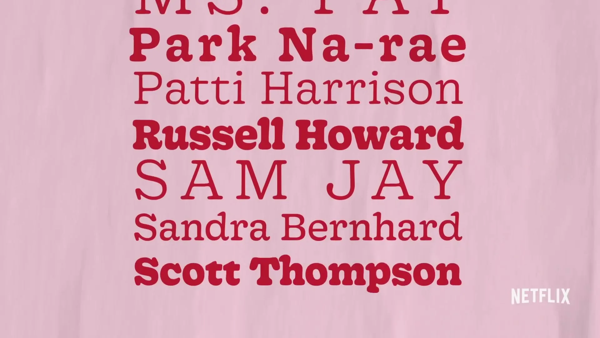 A list of comedians' names in red text scrolls up a light pink background, with the Netflix logo in the bottom right corner.