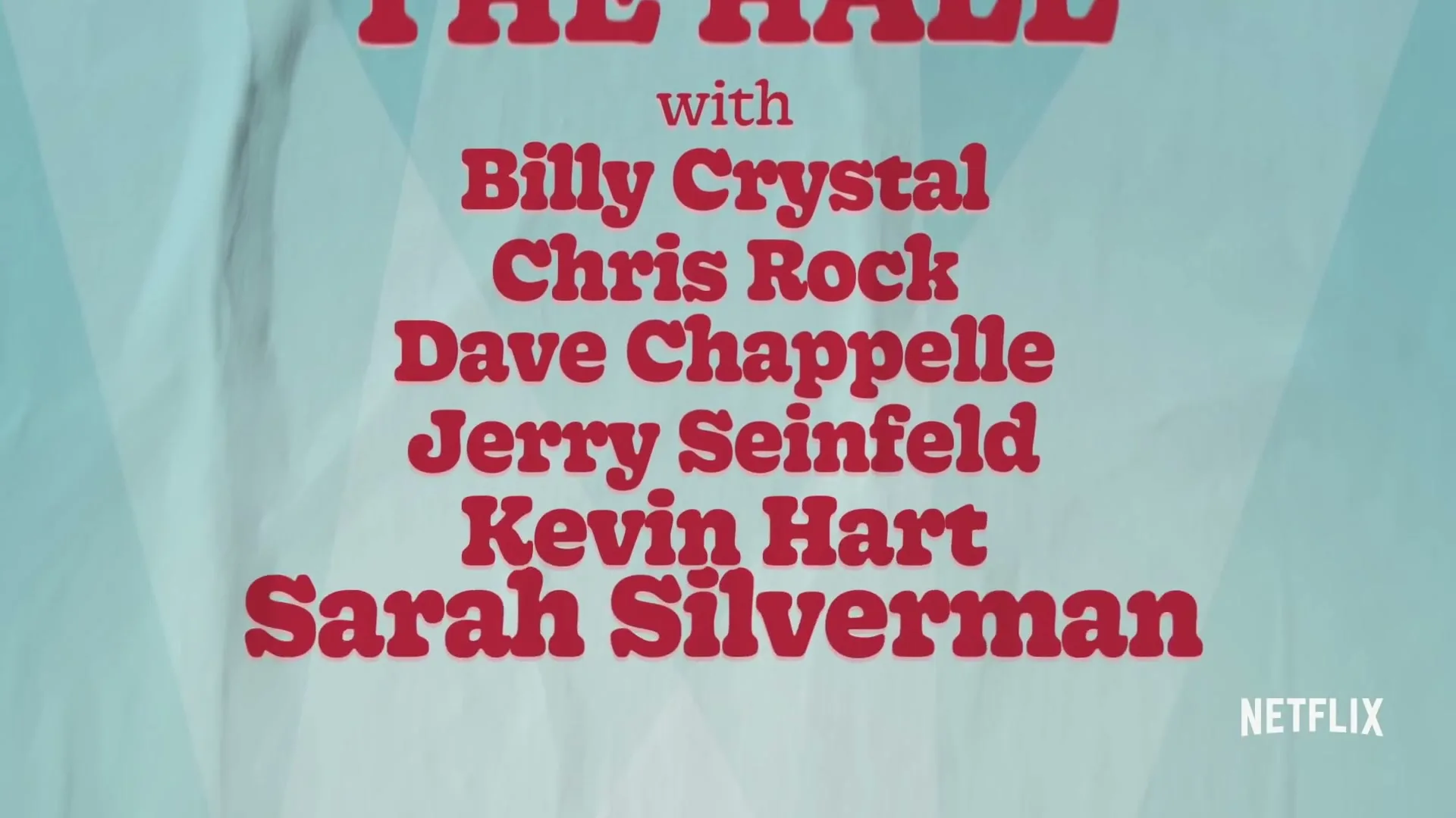 A red curtain opens to reveal a light blue poster with red text listing famous comedians, with the Netflix logo in the bottom right corner.