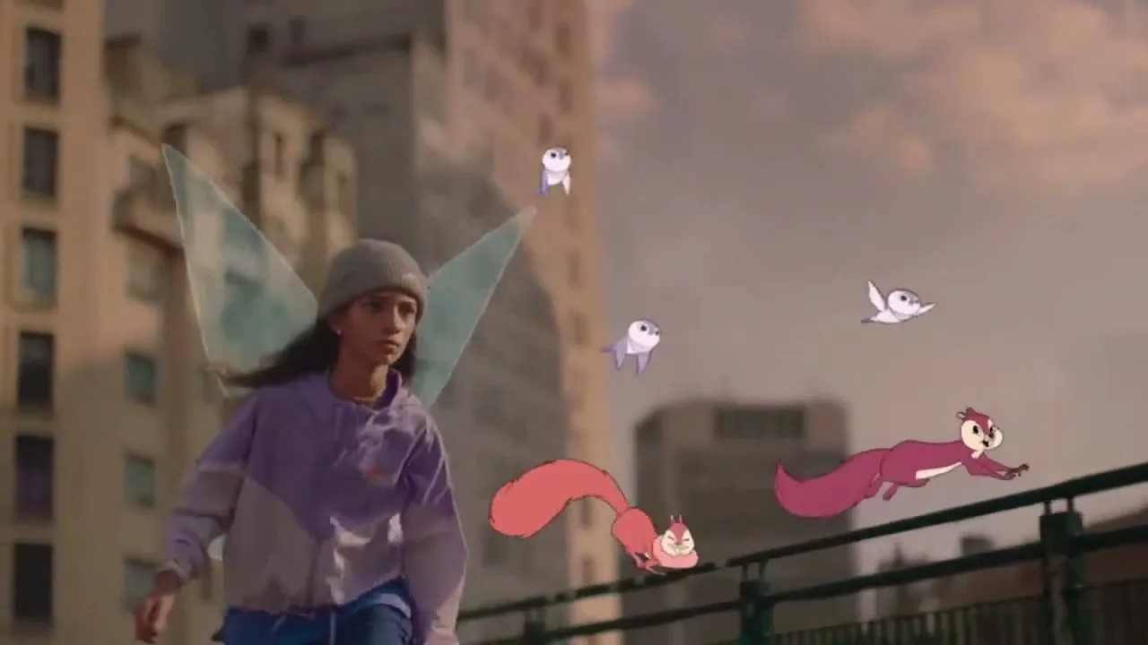 A young woman with fairy wings and a beanie walks forward as animated squirrels and birds follow her in an urban setting.