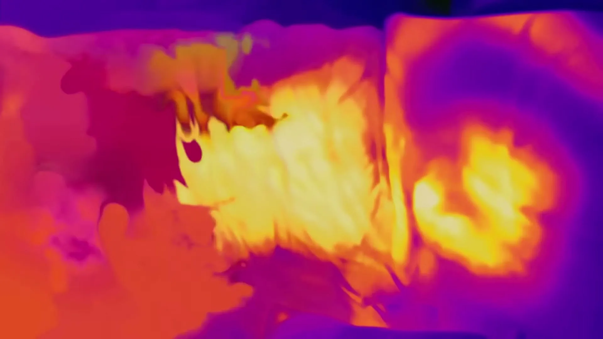 A thermal camera view shows a person tossing and turning in bed, with bright yellow and orange heat signatures against a purple background.