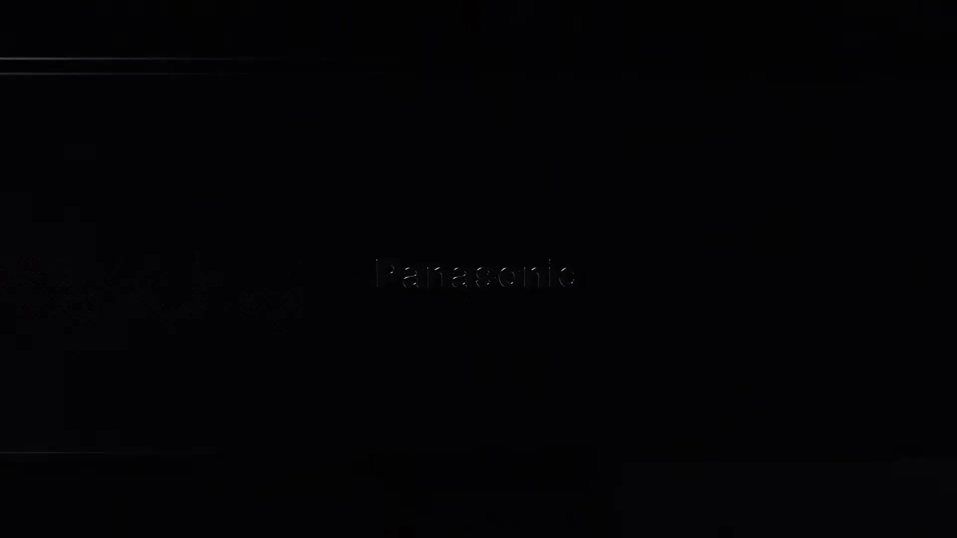 The Panasonic logo appears on a dark, textured background, slowly revealing itself from the darkness.