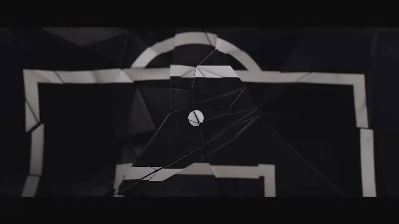 A white soccer goal outline shatters into geometric pieces, revealing a dark, abstract background with a white dot in the center.