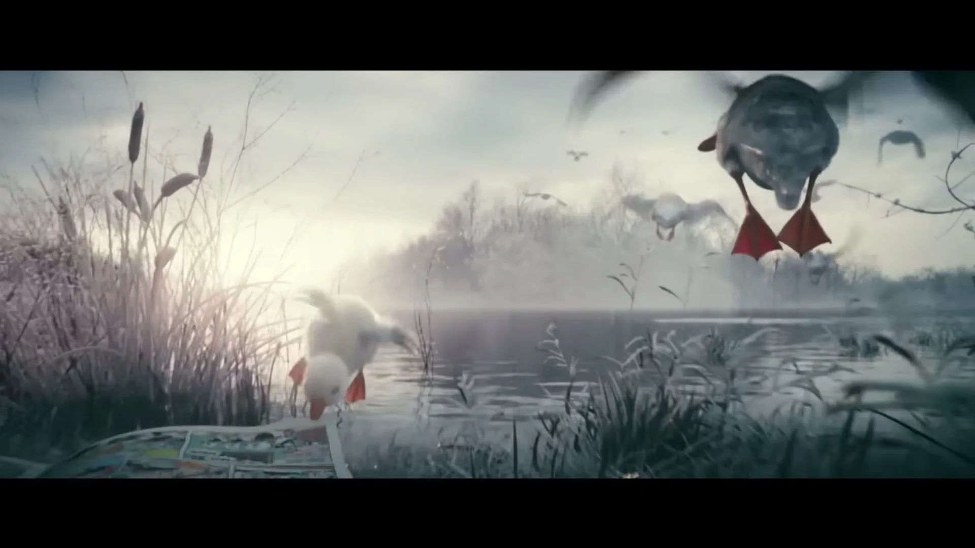 A cute little duckling jumps into the air, flapping its wings, as an adult duck watches from the misty, frosty lakeside.
