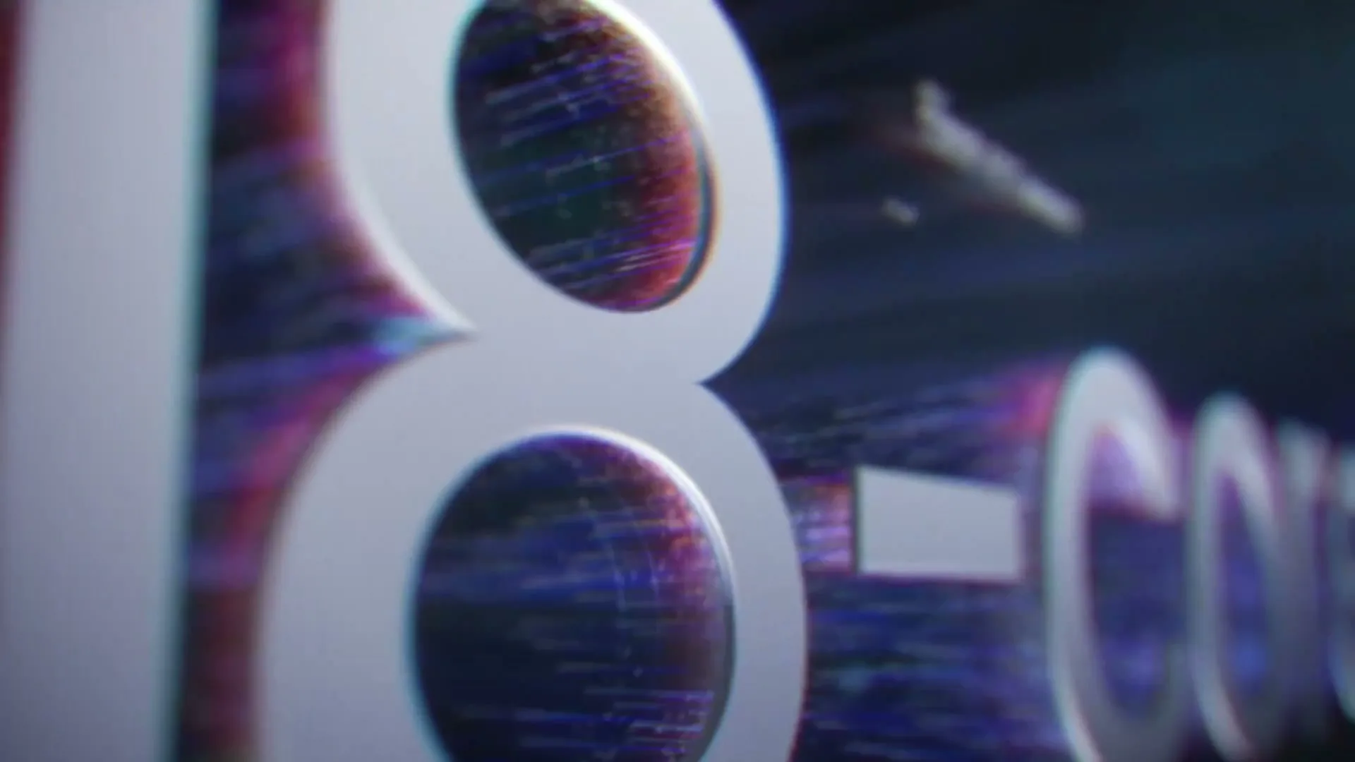A close-up shot of the number "18" and the word "-CORE" in white 3D text, with a glitching, colorful background.
