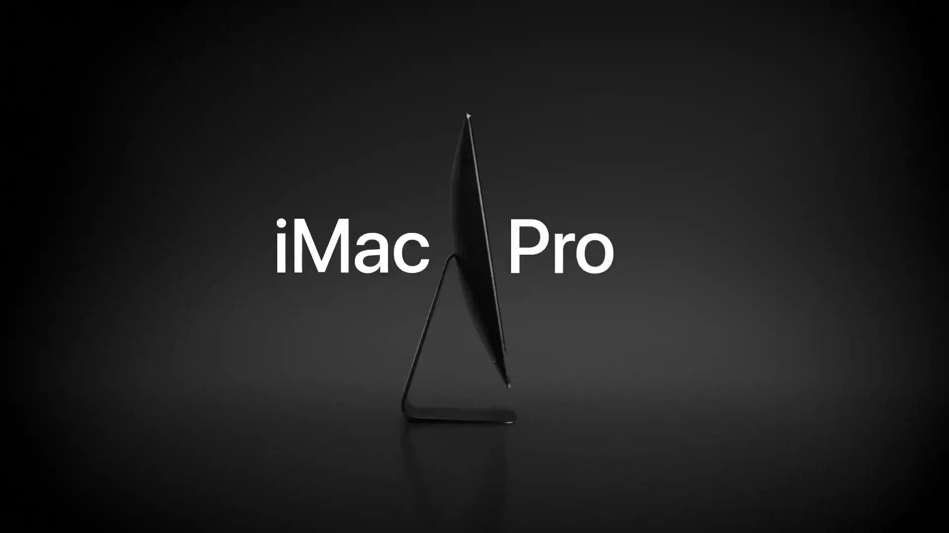 The iMac Pro is shown in a clean, dark studio environment, with the product name displayed prominently on screen.