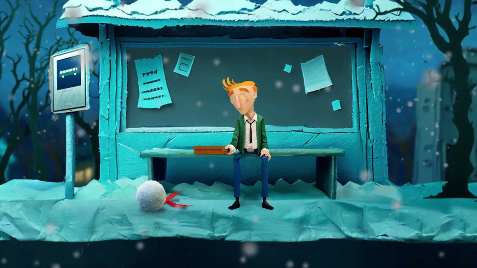 A stop-motion animated man with orange hair sits at a snowy bus stop, holding a small brown box, as a snowball with a red ribbon rolls towards him.