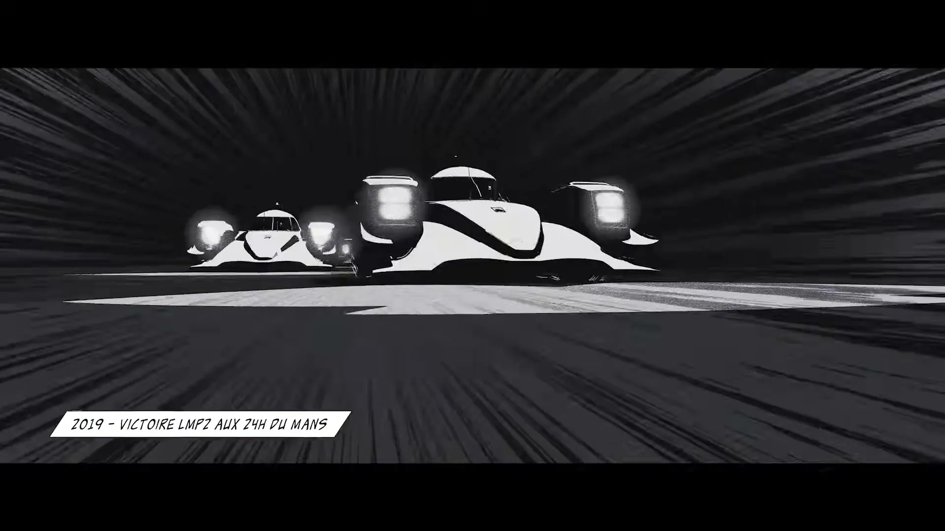 A black and white animated race car speeds past the camera on a dark track, with streaks of light emphasizing its rapid movement.