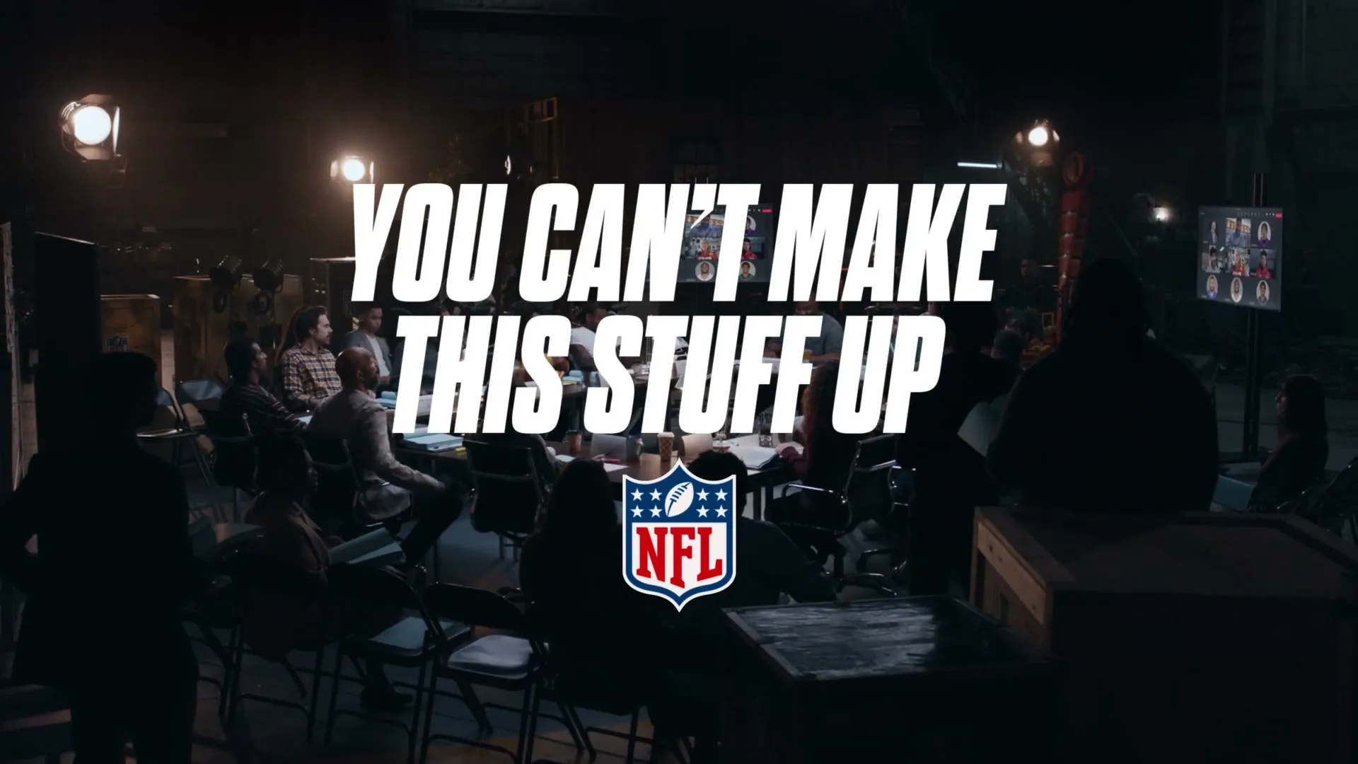 A group of people sit in a dimly lit room with studio lights, as the text "YOU CAN'T MAKE THIS STUFF UP" and the NFL logo appear on screen.