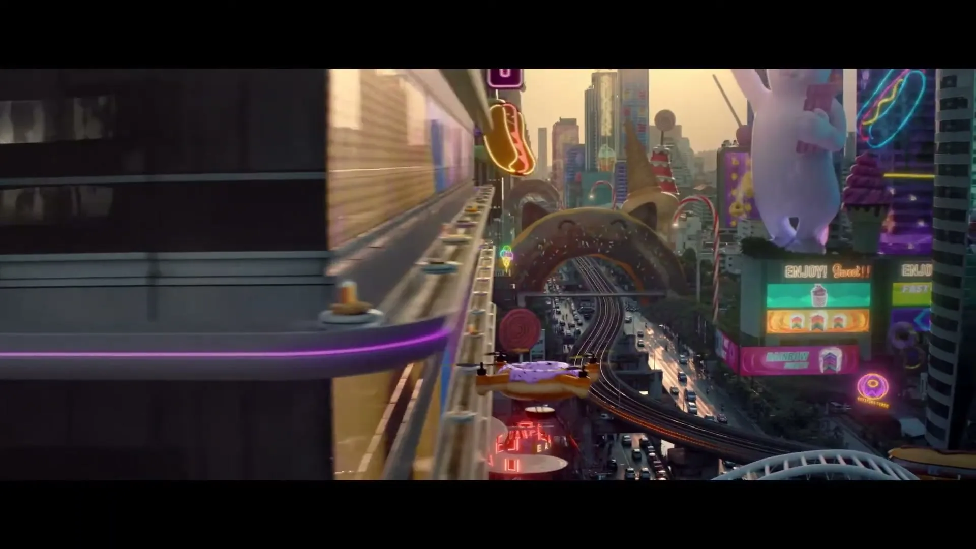 A donut-shaped drone flies past a monorail track in a fantastical city made of sweets and snacks, with a giant white cat-like creature in the background.