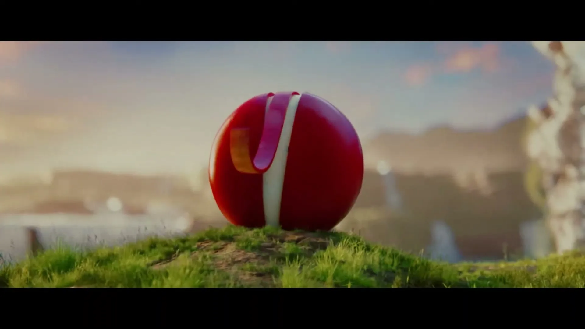 A red Babybel cheese wheel, with a white interior and small eyes, sits on a grassy hill, opening up to reveal its cheesy goodness.