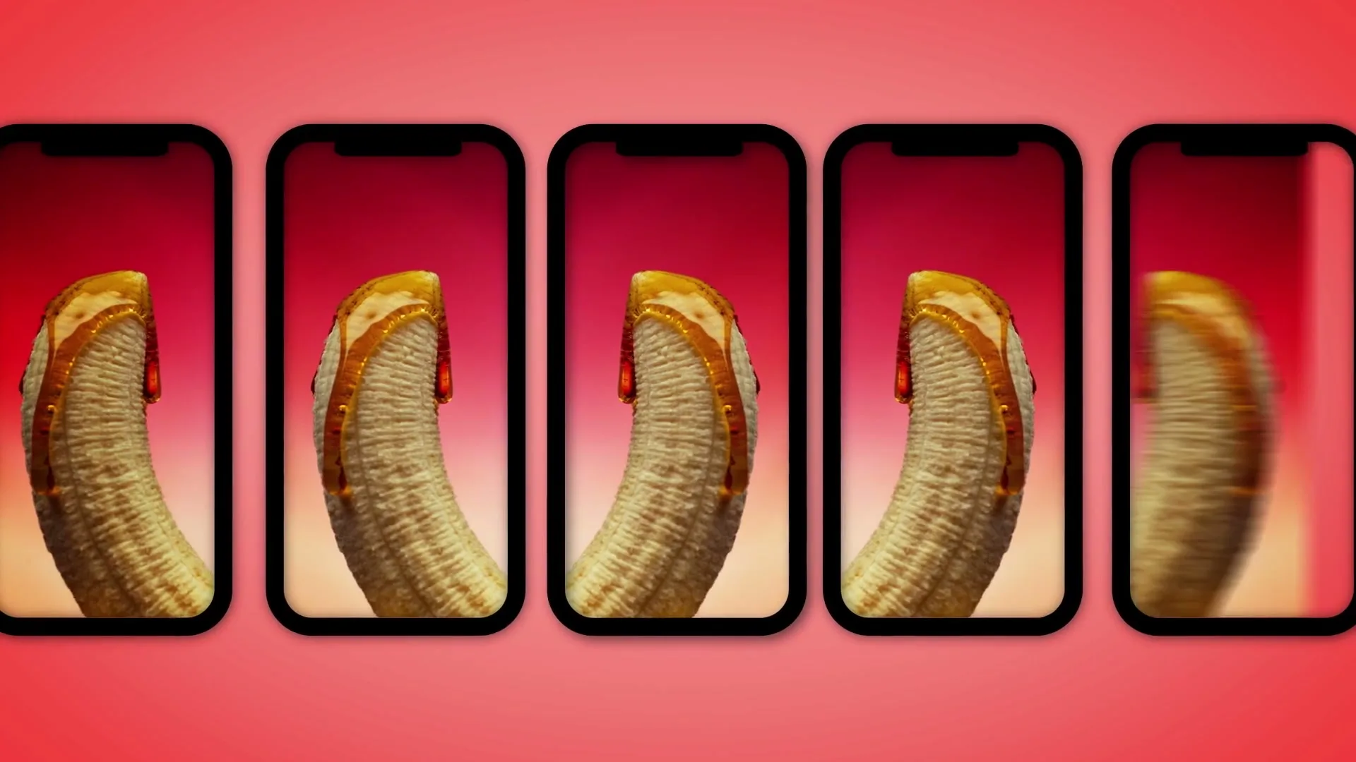 A banana with honey dripping on it is shown on a smartphone screen, which is duplicated and moves across a red background.