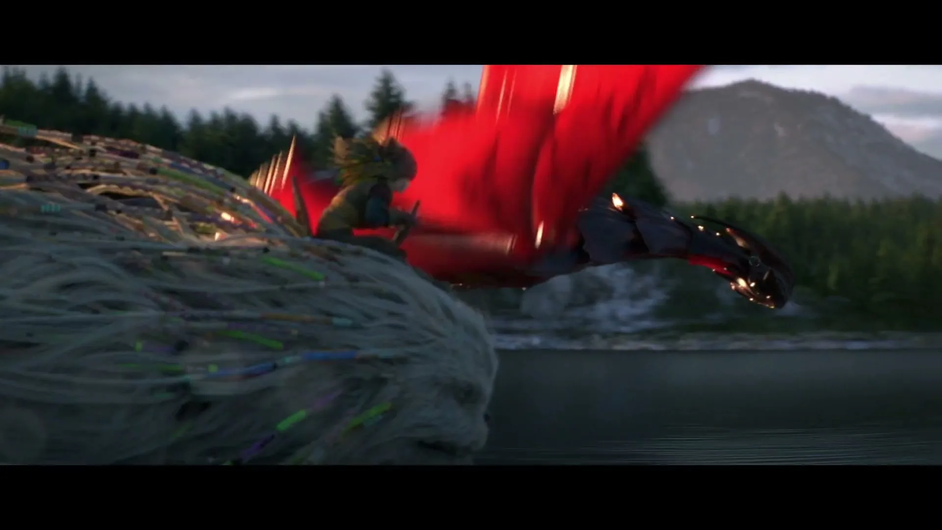 A small, green-haired creature rides a large, furry white beast with colorful strands, racing a red-winged dragon over a lake with mountains and trees in the background.