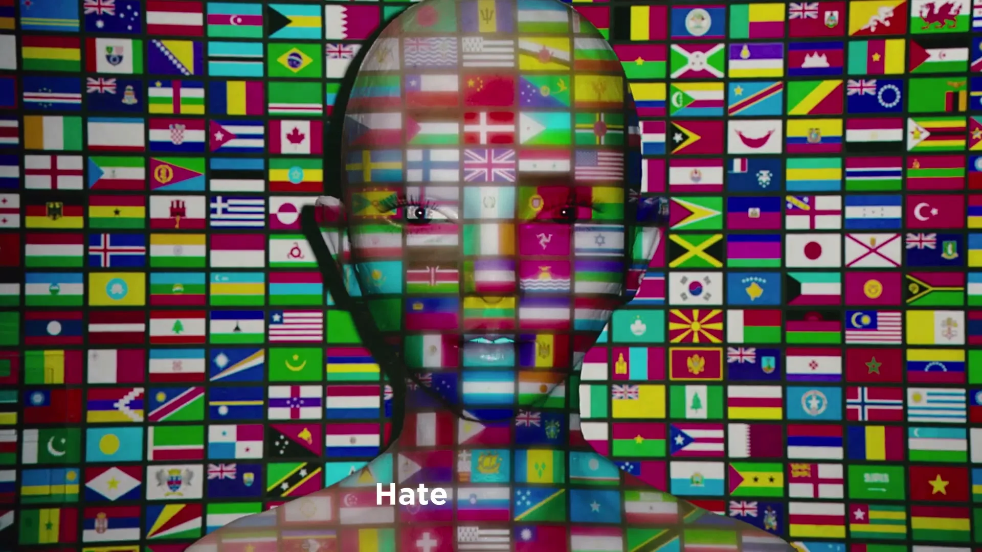 A CG human head, covered in a mosaic of international flags, is centered against a background of more flags, with text appearing on screen.