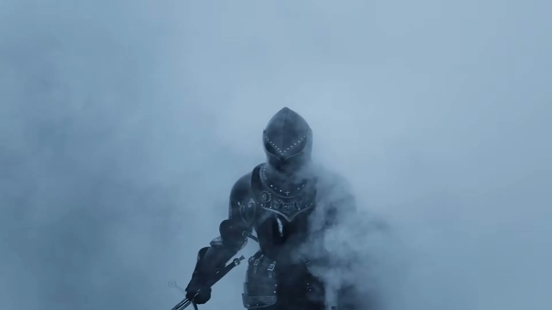 A knight in dark, ornate armor stands amidst a thick, blue-tinted fog, holding a sword.