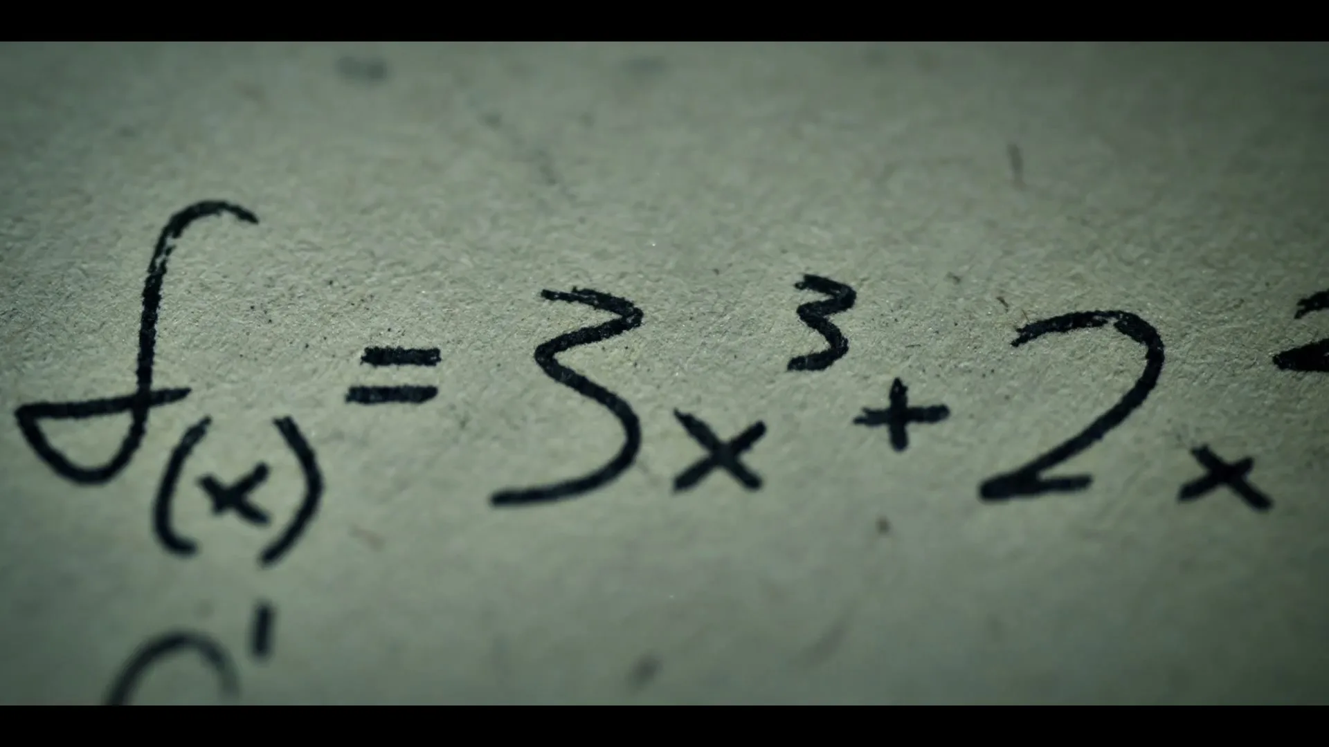 A close-up shot of a piece of paper with handwritten mathematical equations, including "pV/N = kT" and "f(x) = 3x^3 + 2x", written in black ink.