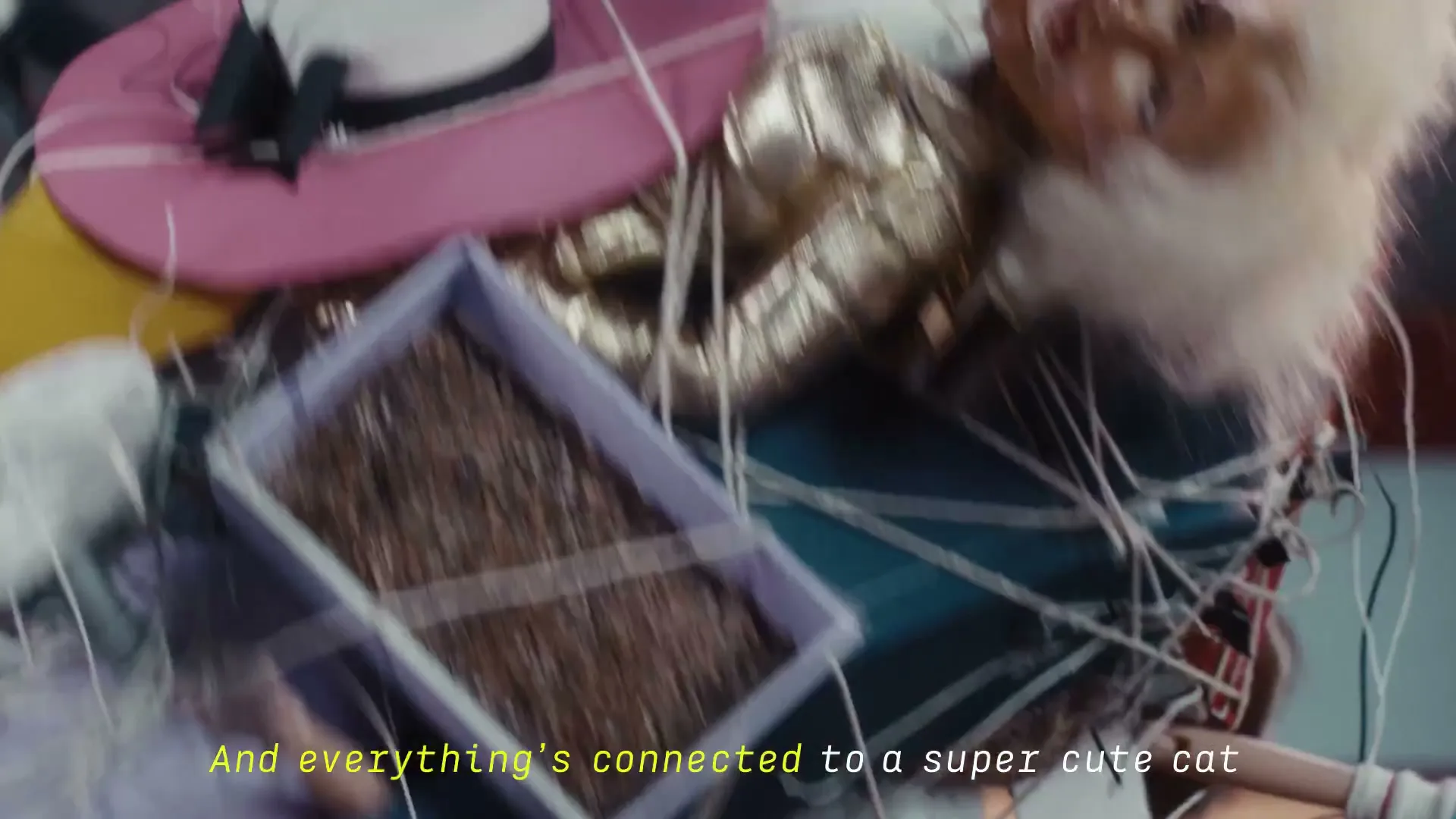 A doll with curlers in her hair is tangled in white string and other objects, falling through a void.