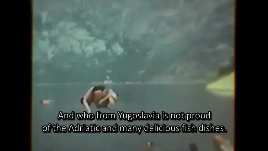 Two people dive into a lake from a small boat, then a table full of fish dishes is shown, in a vintage home video style.