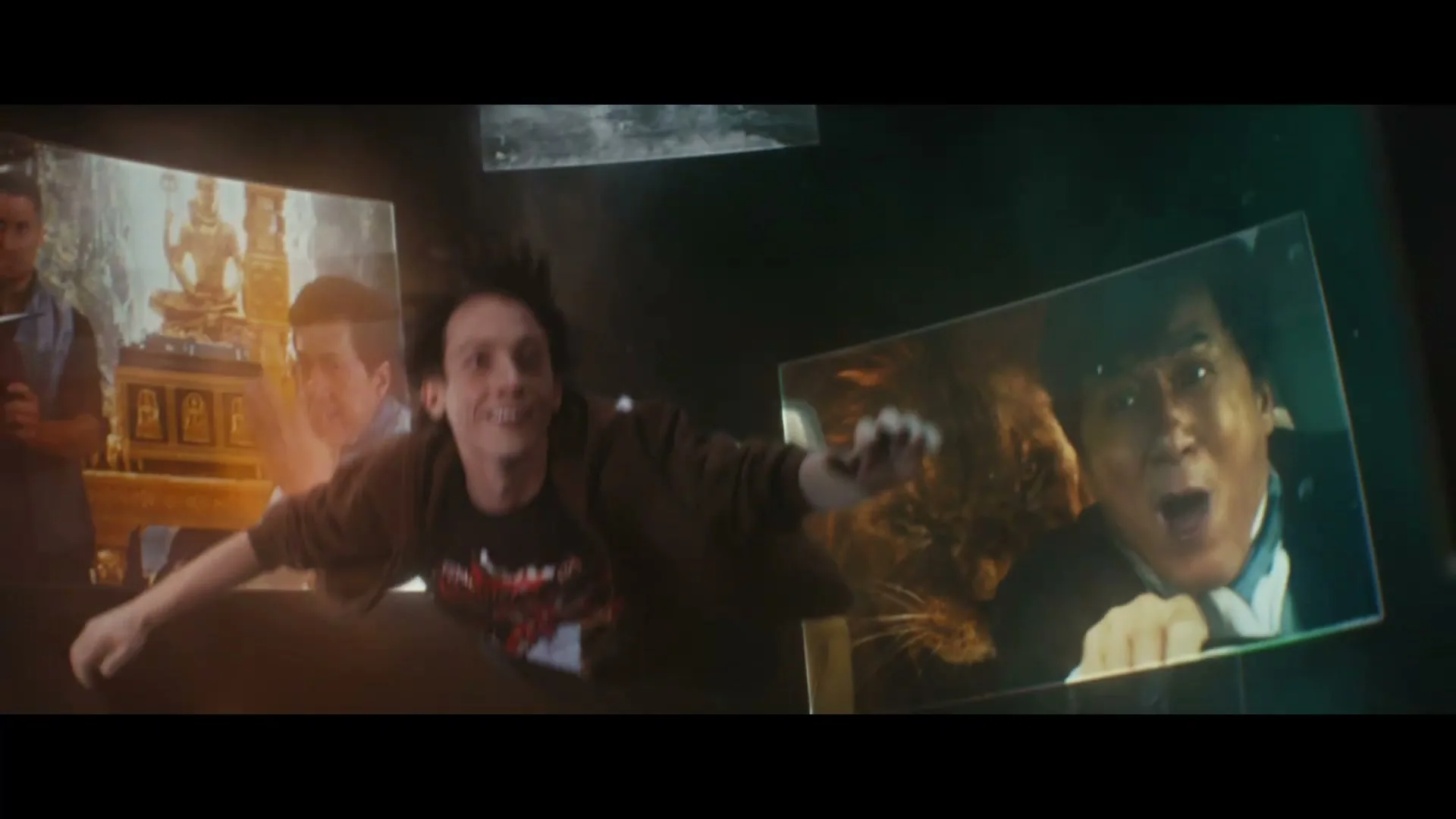A young man in a brown hoodie and black t-shirt falls through a dark void, surrounded by floating images of Jackie Chan in various movie scenes.