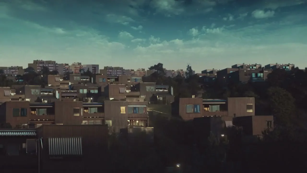 An establishing shot of a suburban neighborhood with many houses on a hill, as the sky transitions from night to day.