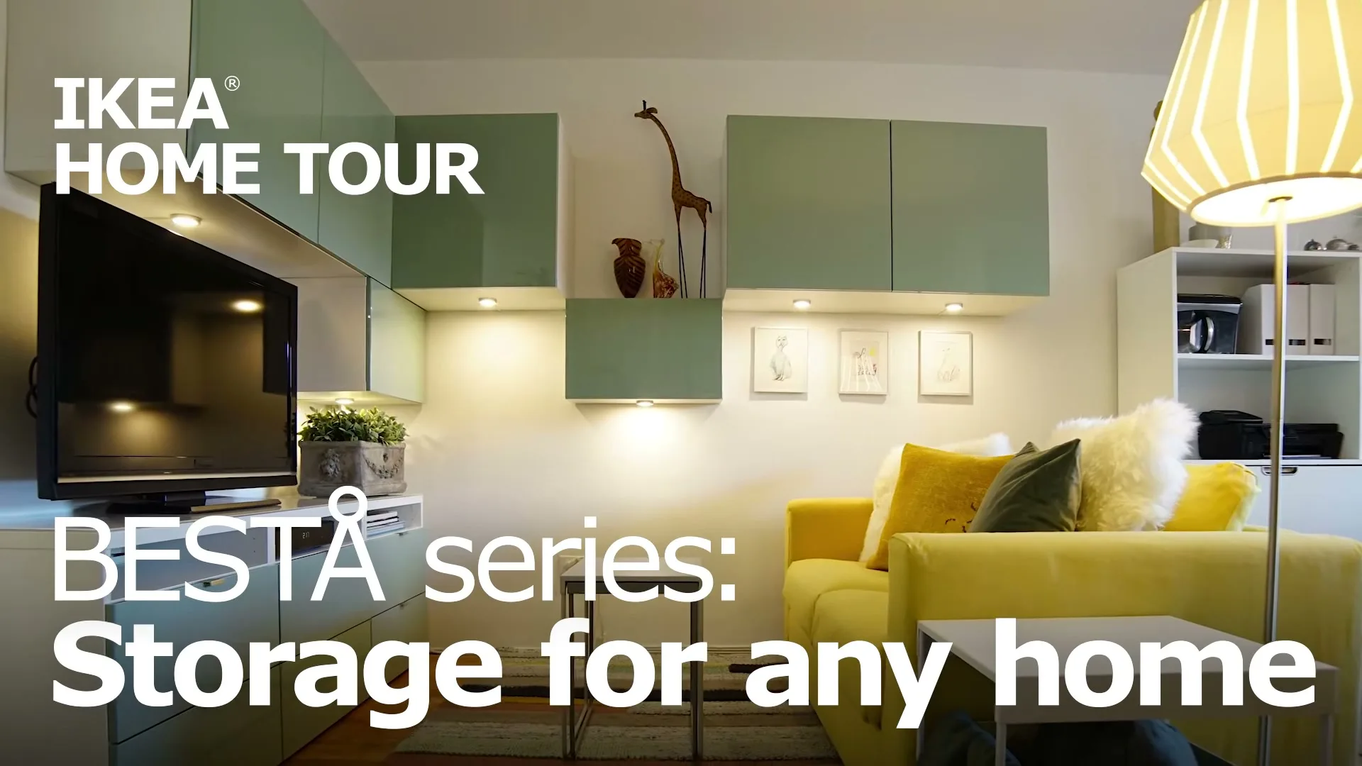 A wide shot of a modern living room with a yellow couch, a TV, and light green cabinets, showcasing organized storage solutions.