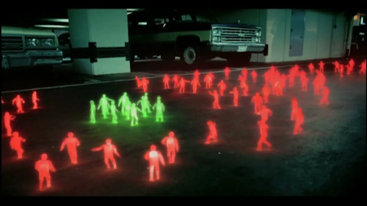 A wide shot shows many glowing red and green stick figures walking around a parking garage with cars in the background.