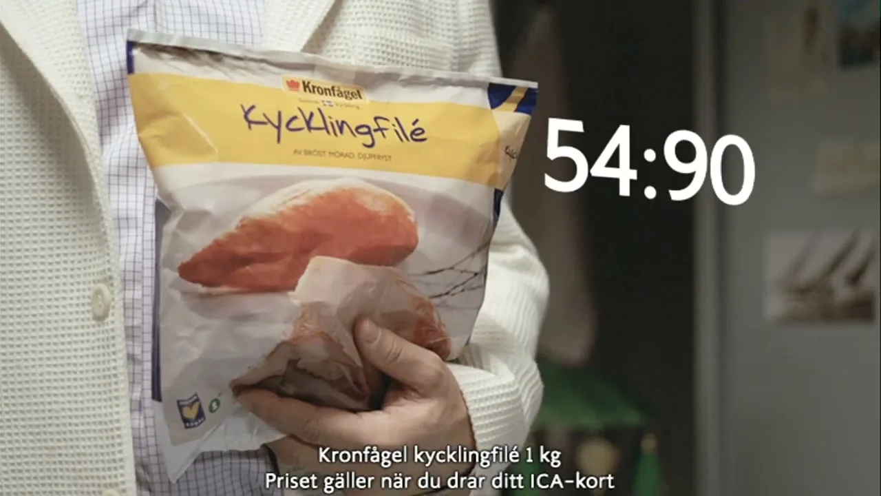 A person in a white jacket holds a bag of Kronfågel chicken fillet, with a price overlay of "54:90" and legal text at the bottom.