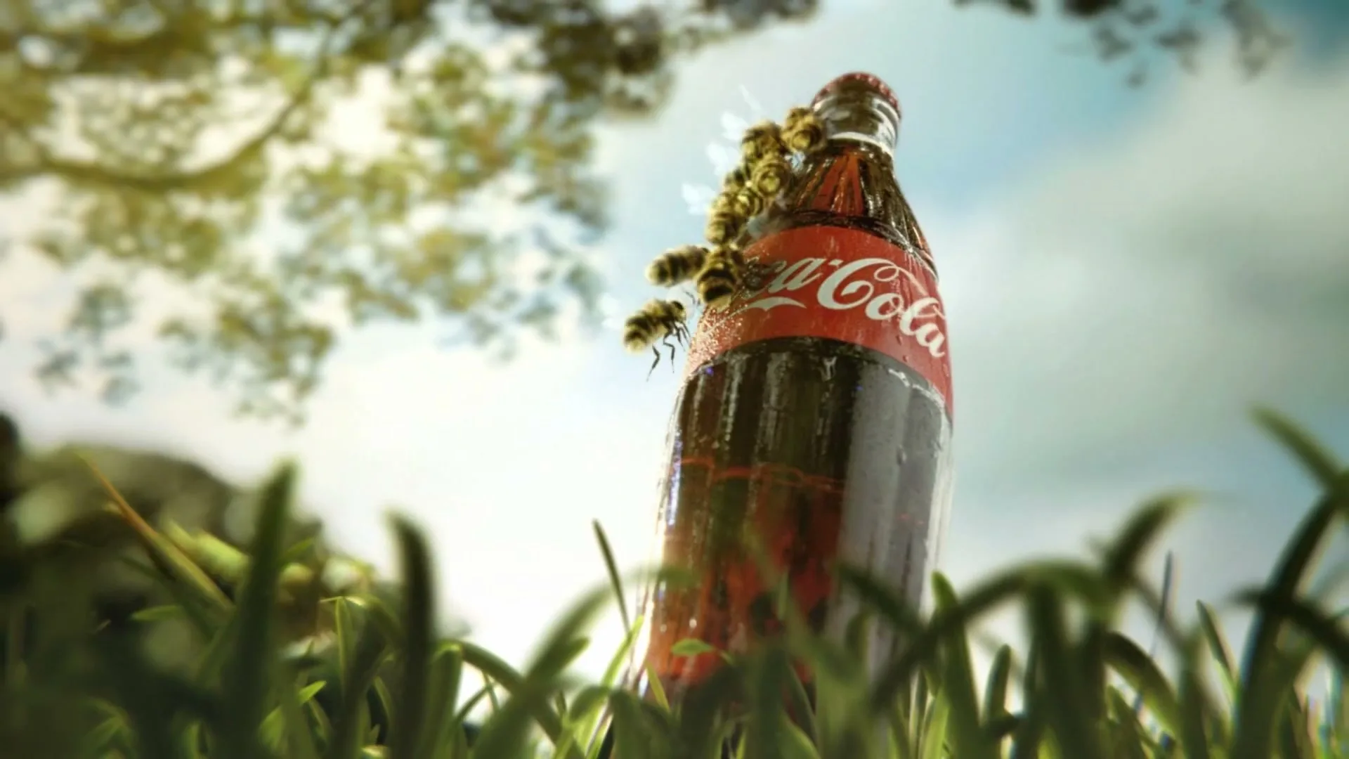 A Coca-Cola bottle stands in green grass with bees swarming around it, under a bright sky with tree branches.
