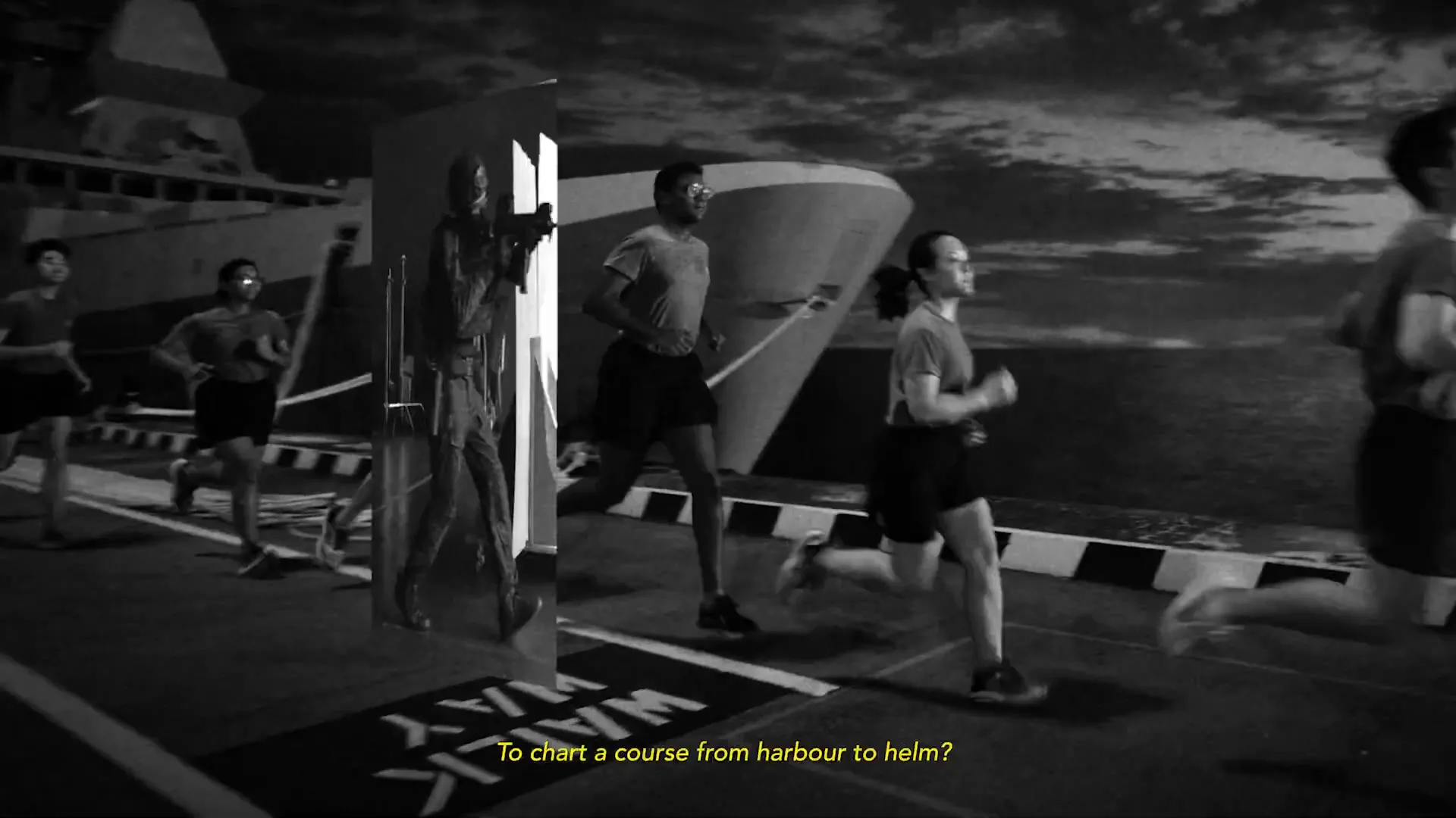 A group of diverse young adults in athletic wear run along a dock at night, with a large naval ship in the background, as a split screen reveals a soldier in action.