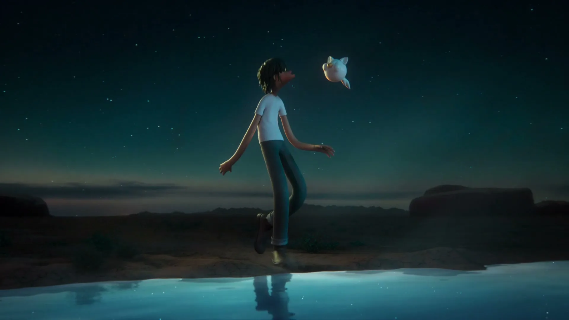 A young animated boy with dark hair and a white t-shirt walks alongside a small, floating white creature next to a reflective pool of water in a desert landscape at dusk.