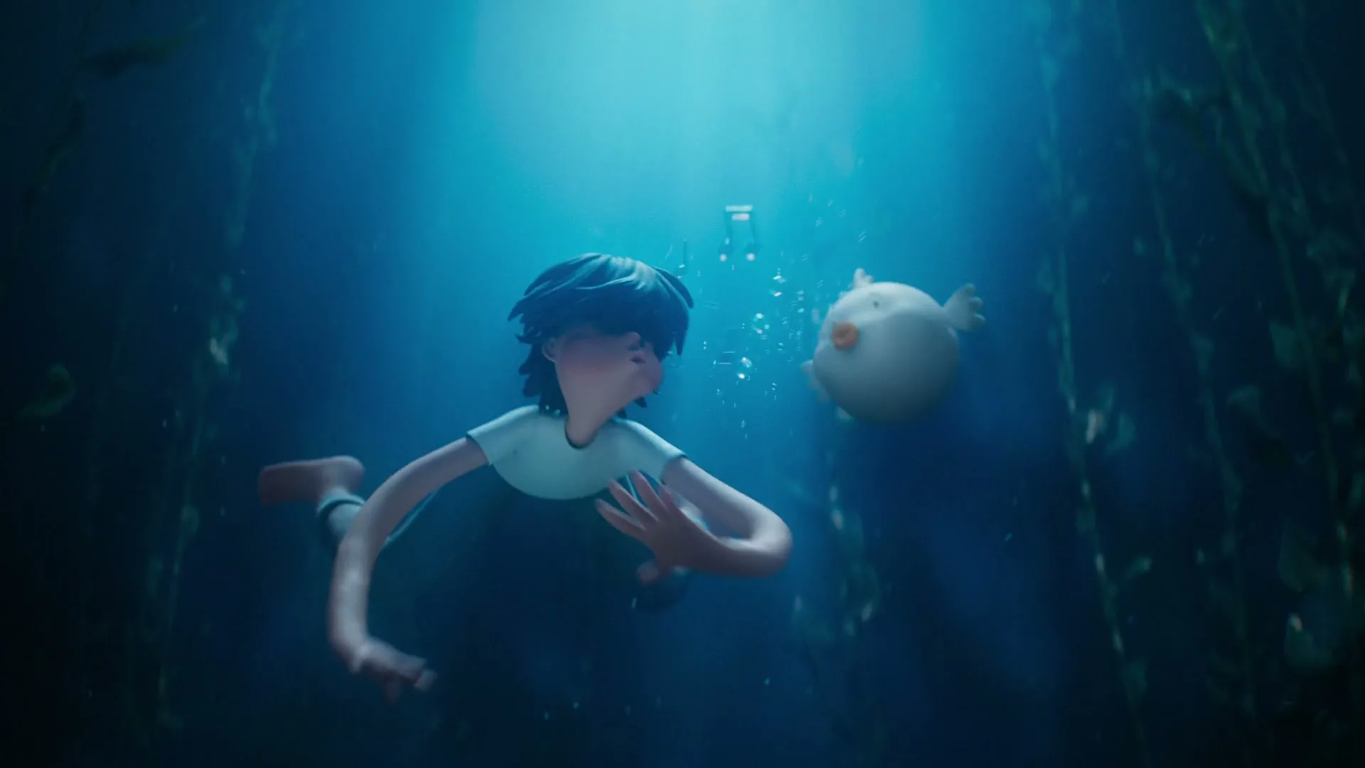A young boy with dark hair and a small white bird-like creature swim together underwater, surrounded by dark seaweed.