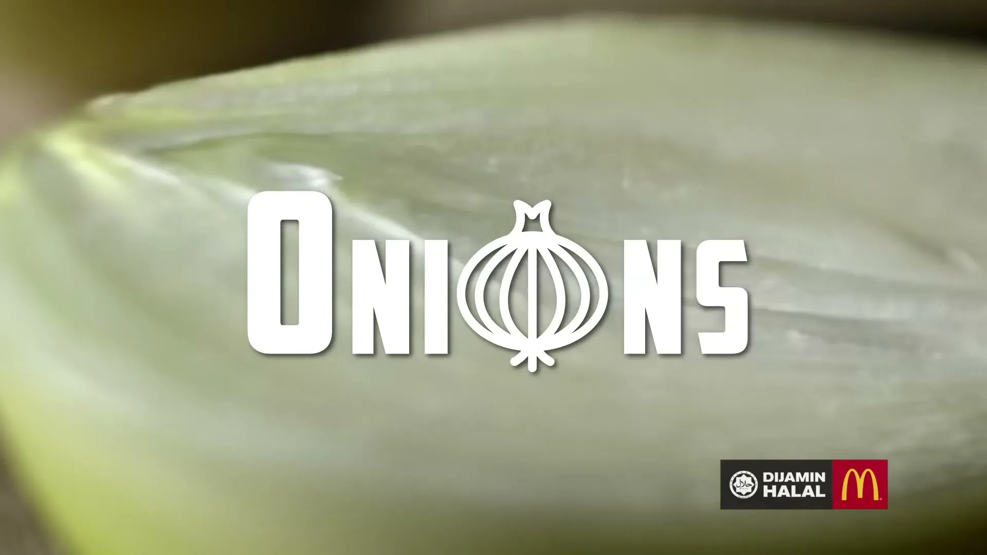 A close-up shot of a sliced onion with the word "ONIONS" superimposed on it, and the McDonald's logo in the bottom right corner.