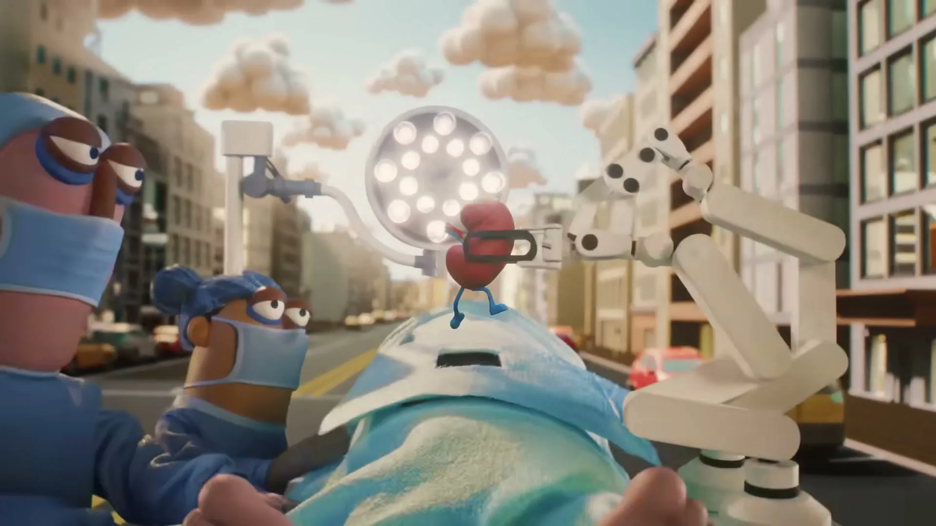 Two animated surgeons operate on a patient in the middle of a city street, as a robotic arm removes a kidney.