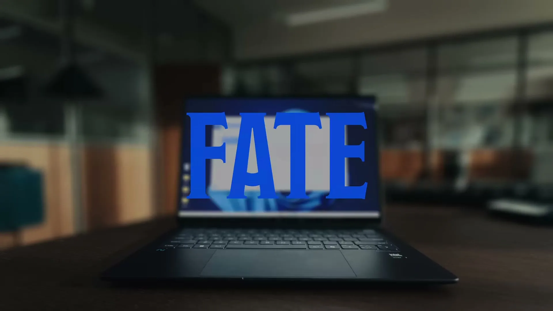 A laptop screen displays a chat interface with text, then the words "FATE" and "HEROISM" appear sequentially over the screen, in an office setting.