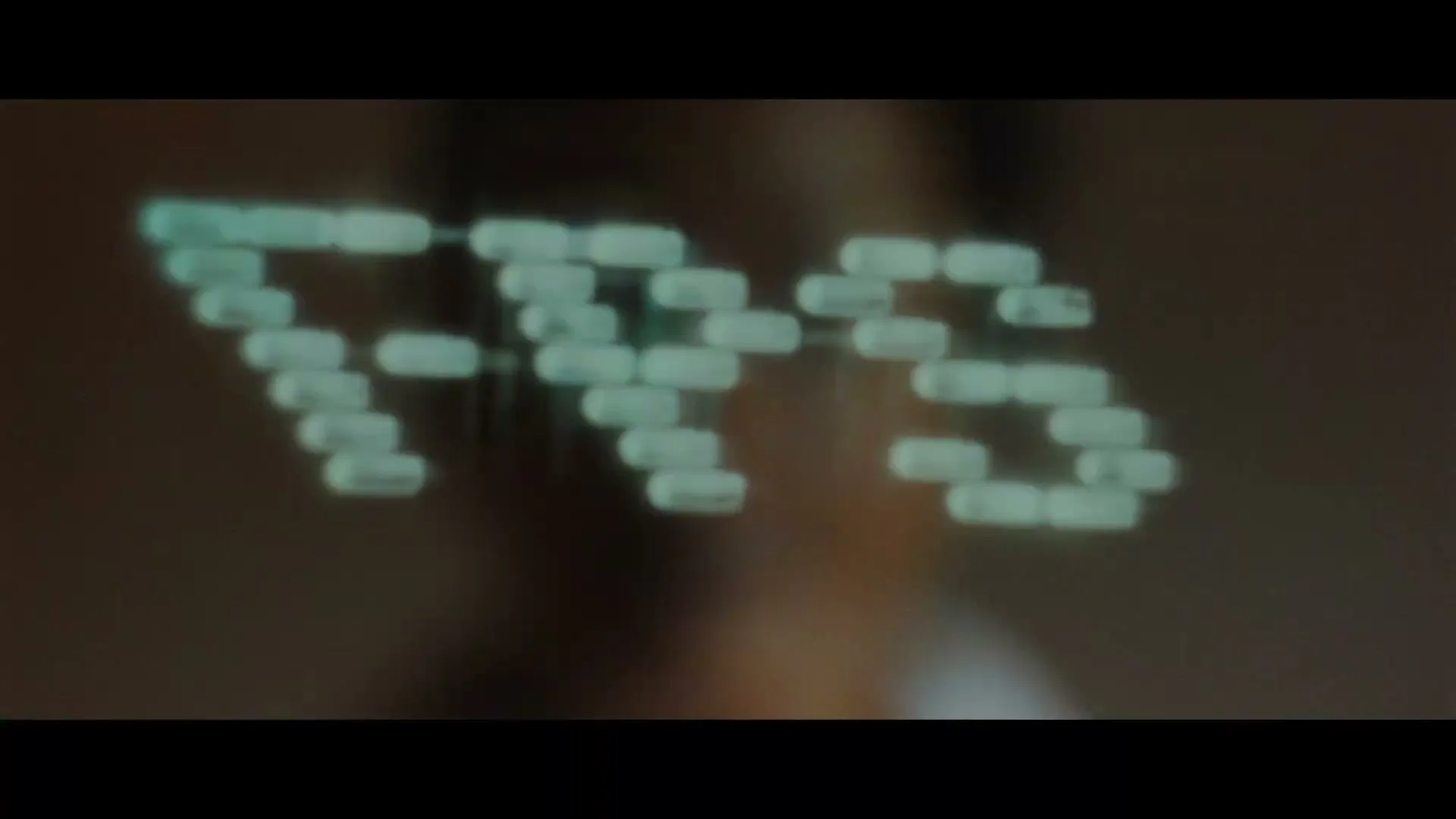 A woman in a bathrobe is seen in a medium closeup, with green light on her face, as the word "RAZOR" appears and then disappears on screen.