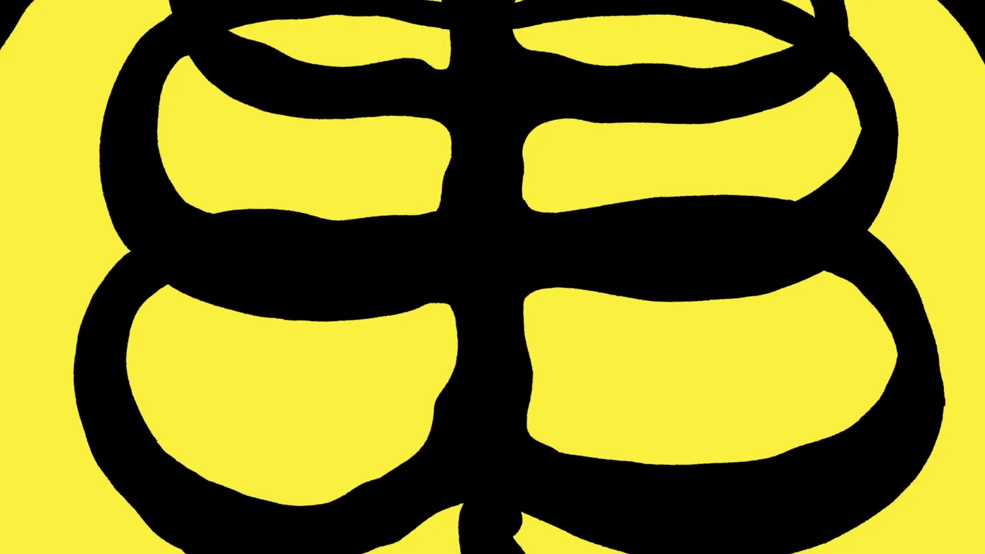A black, abstract, symmetrical design on a bright yellow background, resembling a stylized face or symbol, slowly zooms out to reveal more of its intricate patterns.