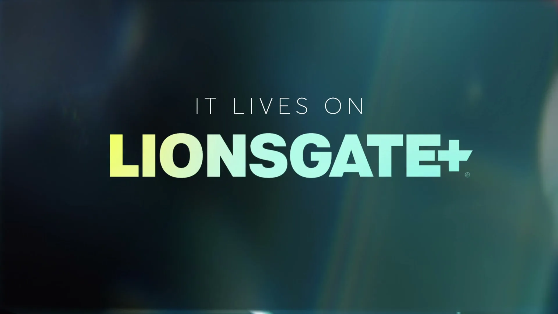The Lionsgate+ logo and tagline "IT LIVES ON" appear over a blurry background of a woman in a patterned shirt.